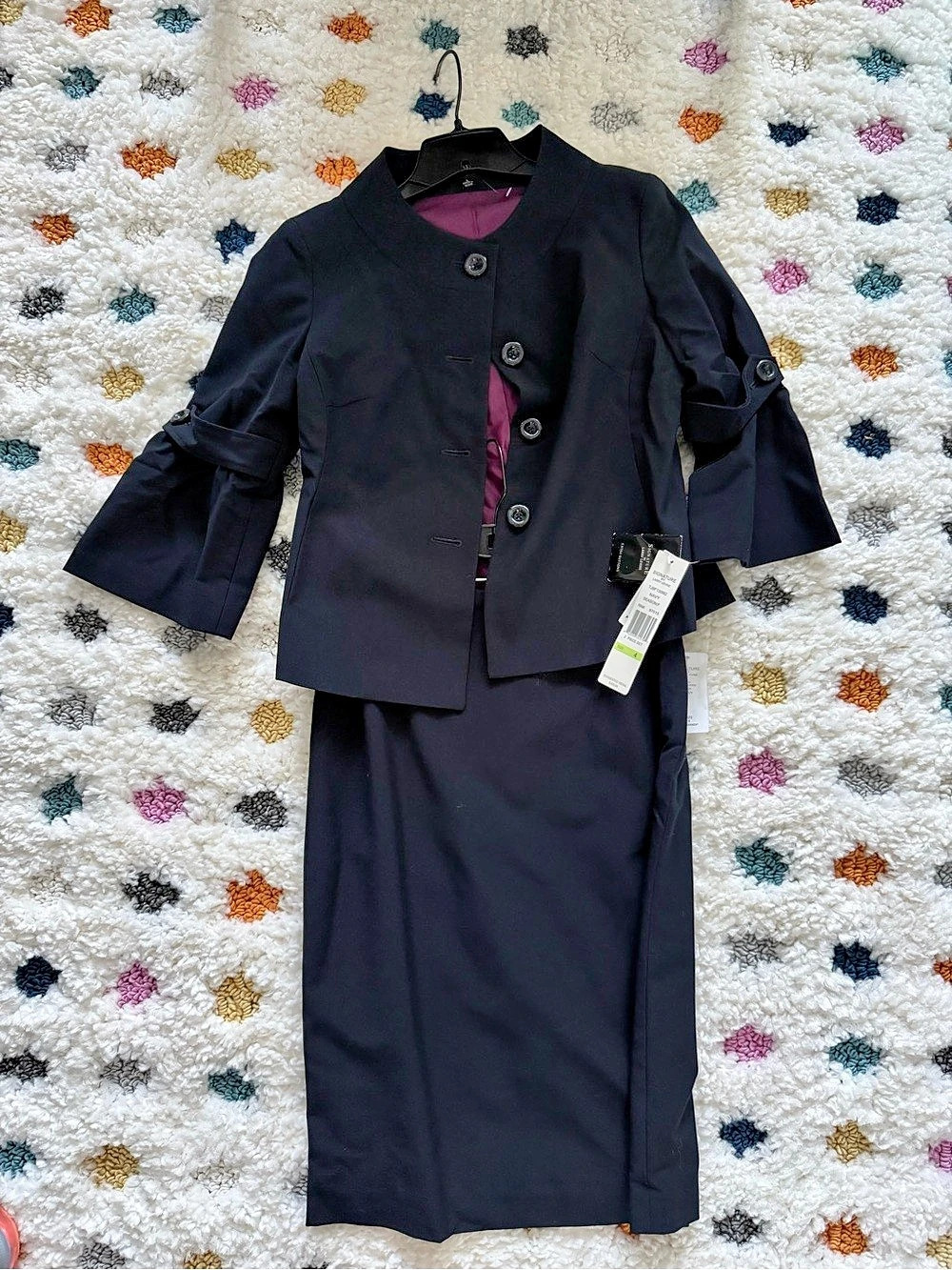 Signature by Larry Levine.   Navy suit.